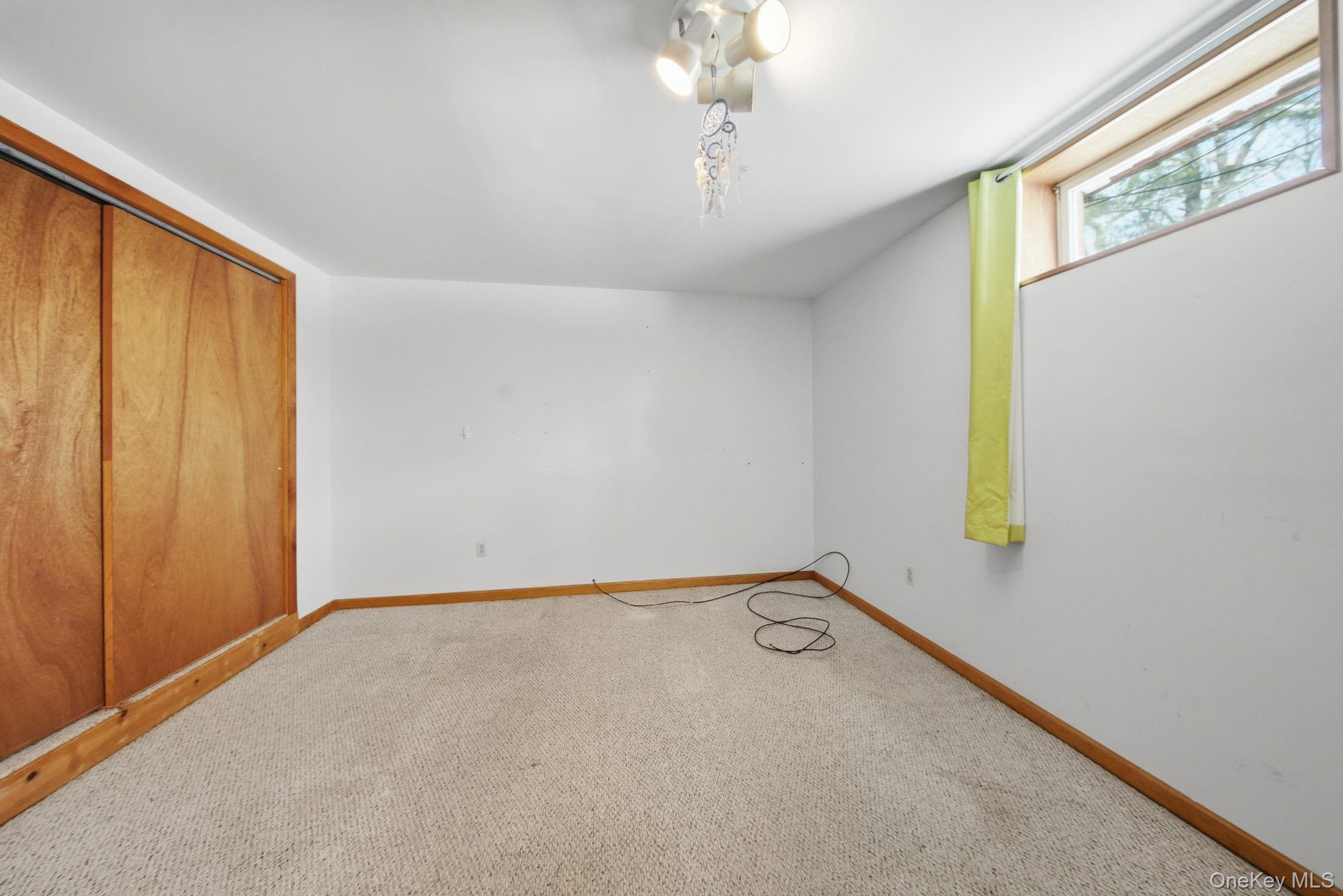 139 Renner Road Mountain Dale, NY 12763 - Photo 32 of 49 a view of an empty room with a window