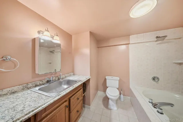 a bathroom with a tub and a window