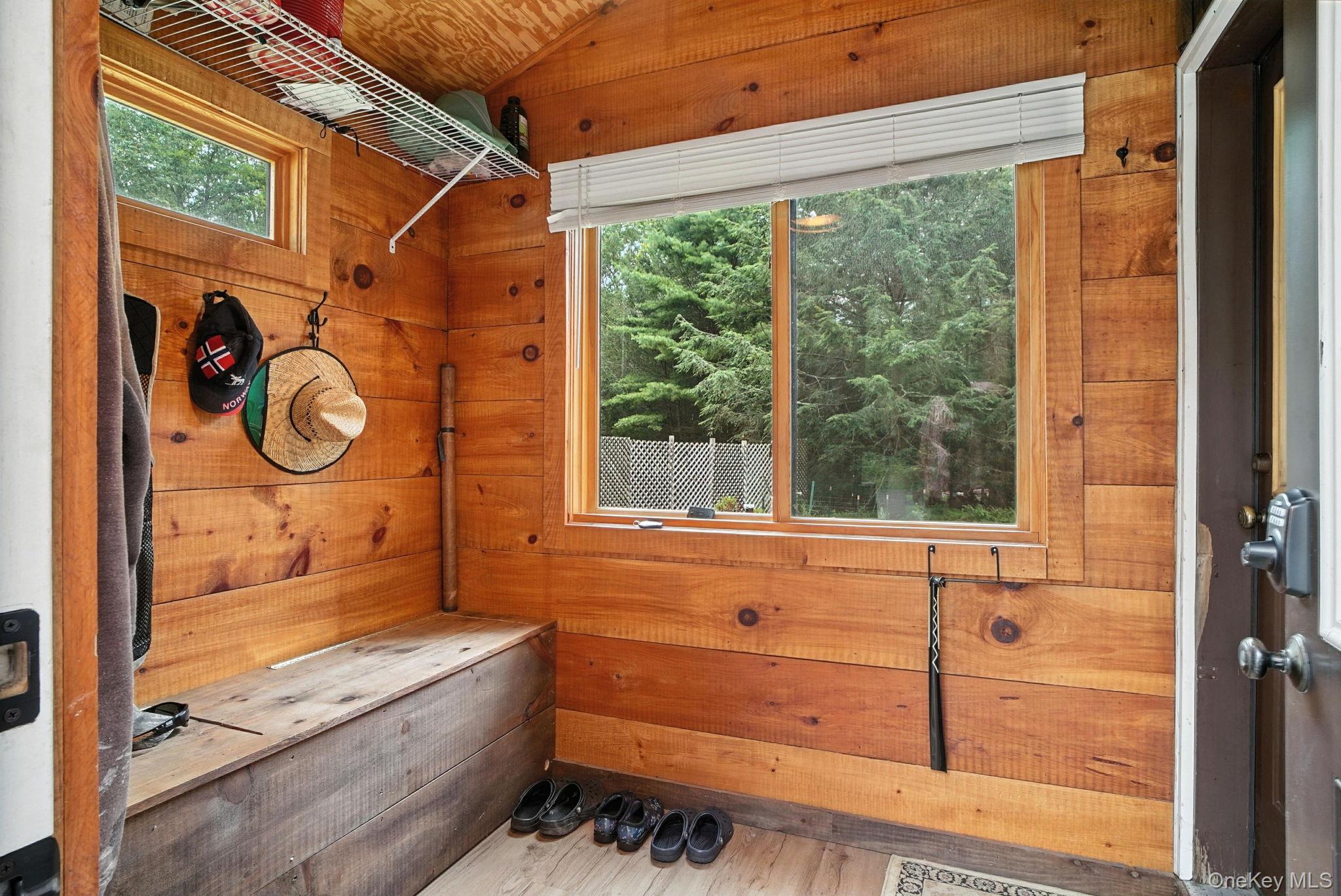 139 Renner Road Mountain Dale, NY 12763 - Photo 35 of 50 Mudroom with wooden walls, vaulted ceiling, and wood finished floors