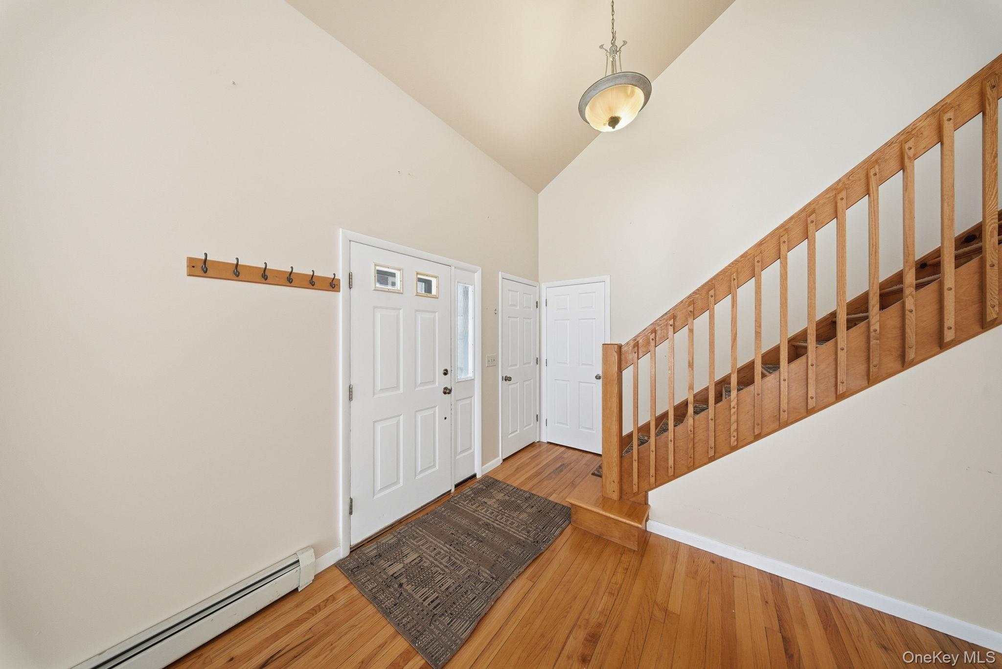 139 Renner Road Mountain Dale, NY 12763 - Photo 4 of 49 a view of a hallway with wooden floor and staircase