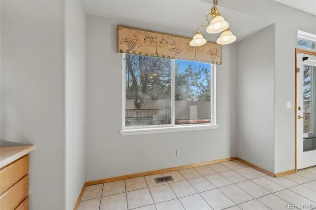 a kitchen with sink and cabinets