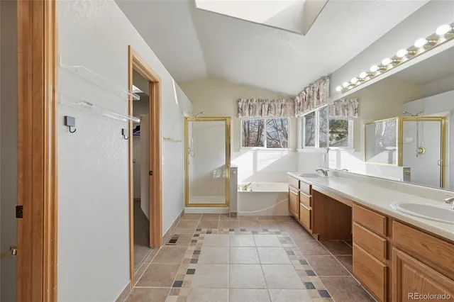 a bathroom with a sink double vanity and a mirror