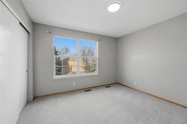 an empty room with a bathroom