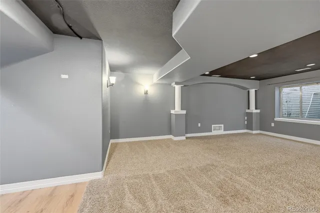 a view of a hallway view with staircase