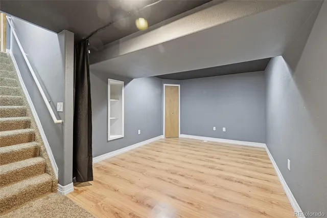 a view of kitchen with refrigerator and window
