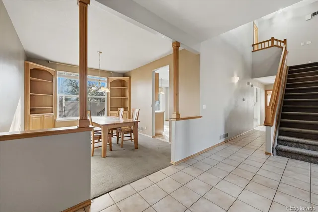 a view of a livingroom with furniture and window