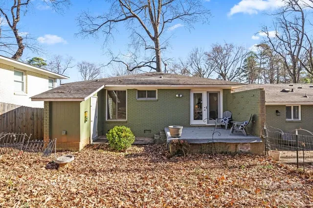 a front view of a house with table and chairs