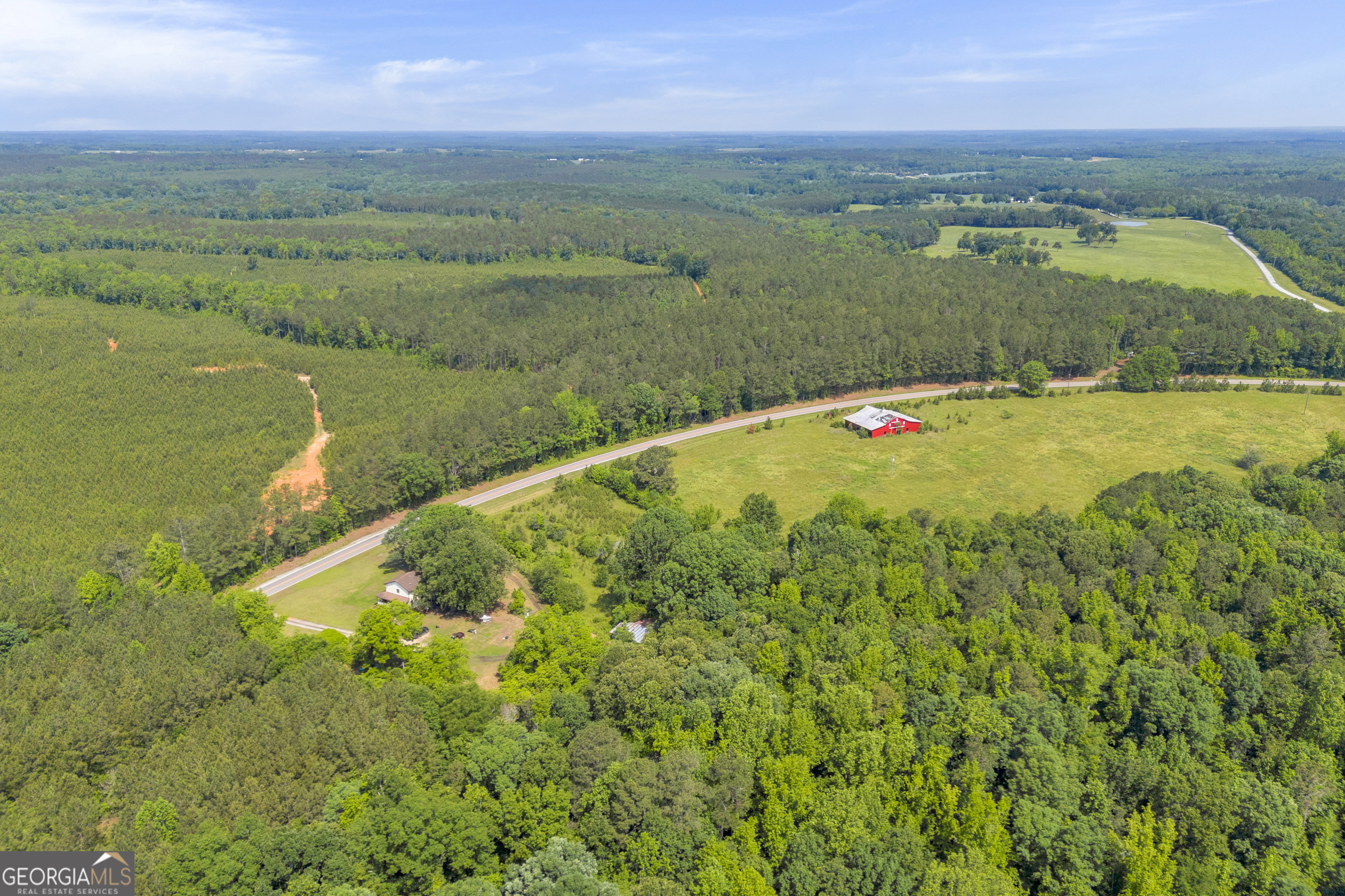 366 Lexington-Carlton Road Lexington, GA 30648 - Photo 12 of 20 a view of a lake with a city