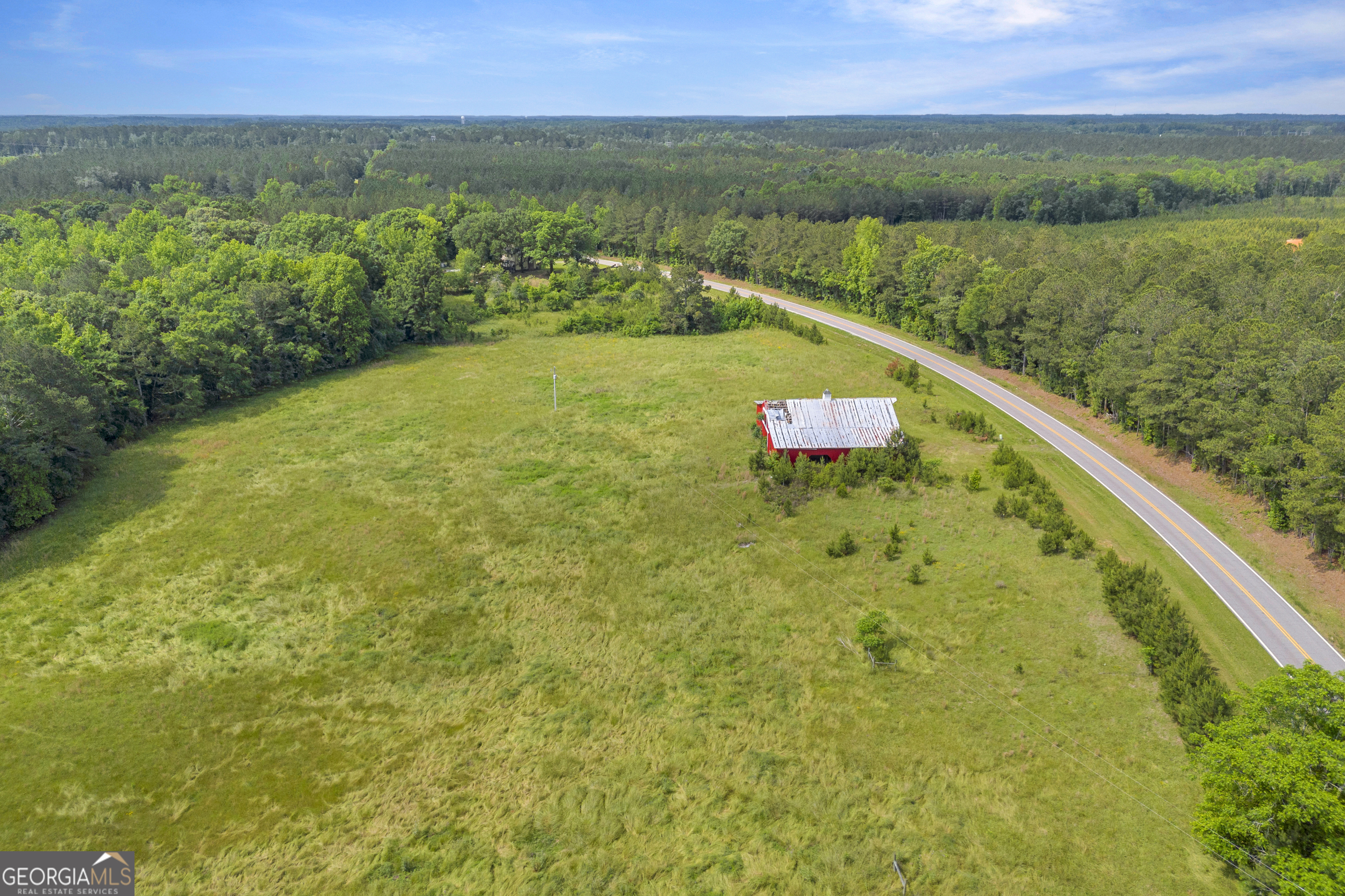 366 Lexington-Carlton Road Lexington, GA 30648 - Photo 9 of 20 a view of a lake with a city