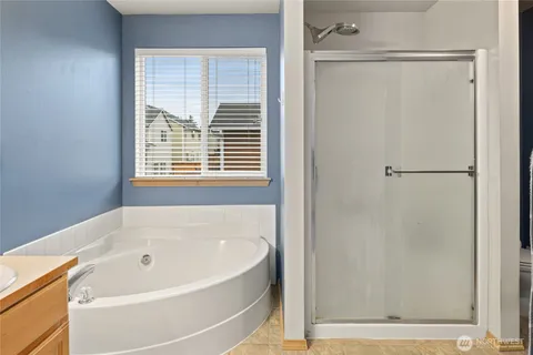 a white bath tub sitting next to a window
