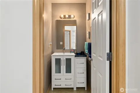 a view of a bathroom with a sink and mirror