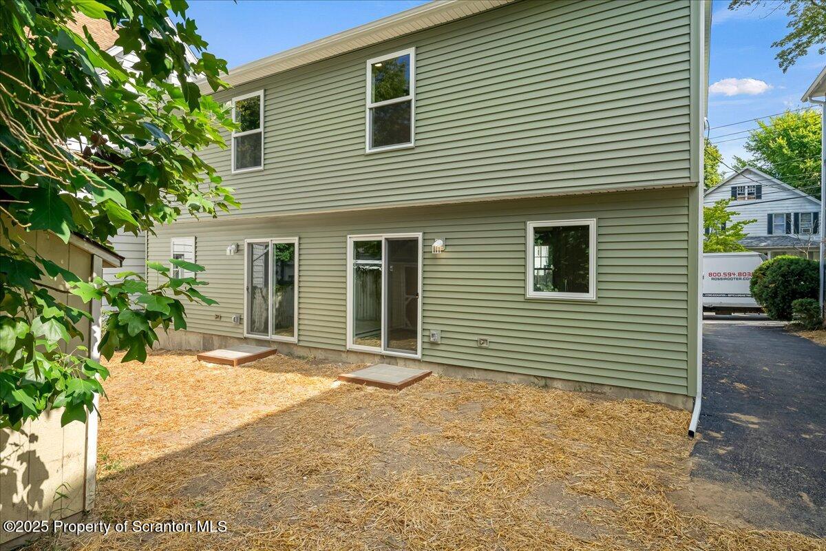 820 822 Delaware Street Scranton, PA 18509 - Photo 34 of 48 a view of a house with a yard and sitting area
