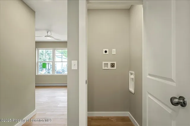 a kitchen with stainless steel appliances a refrigerator a stove top oven a sink and cabinets