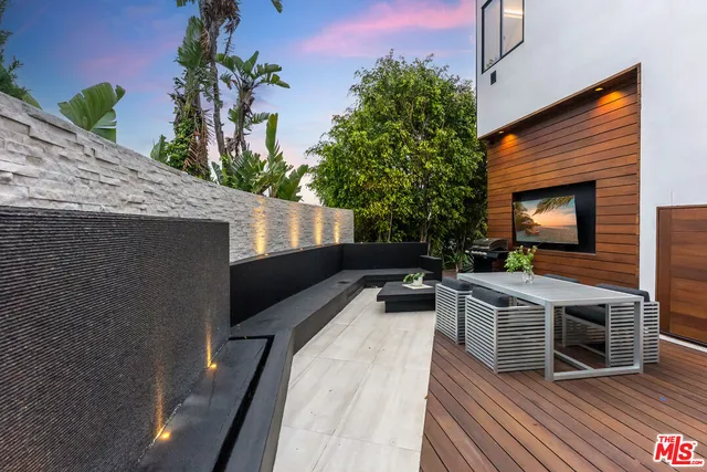 an aerial view of residential houses with city view