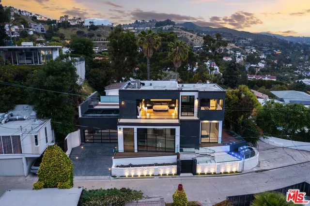 a view of a building with a large window and brick walls