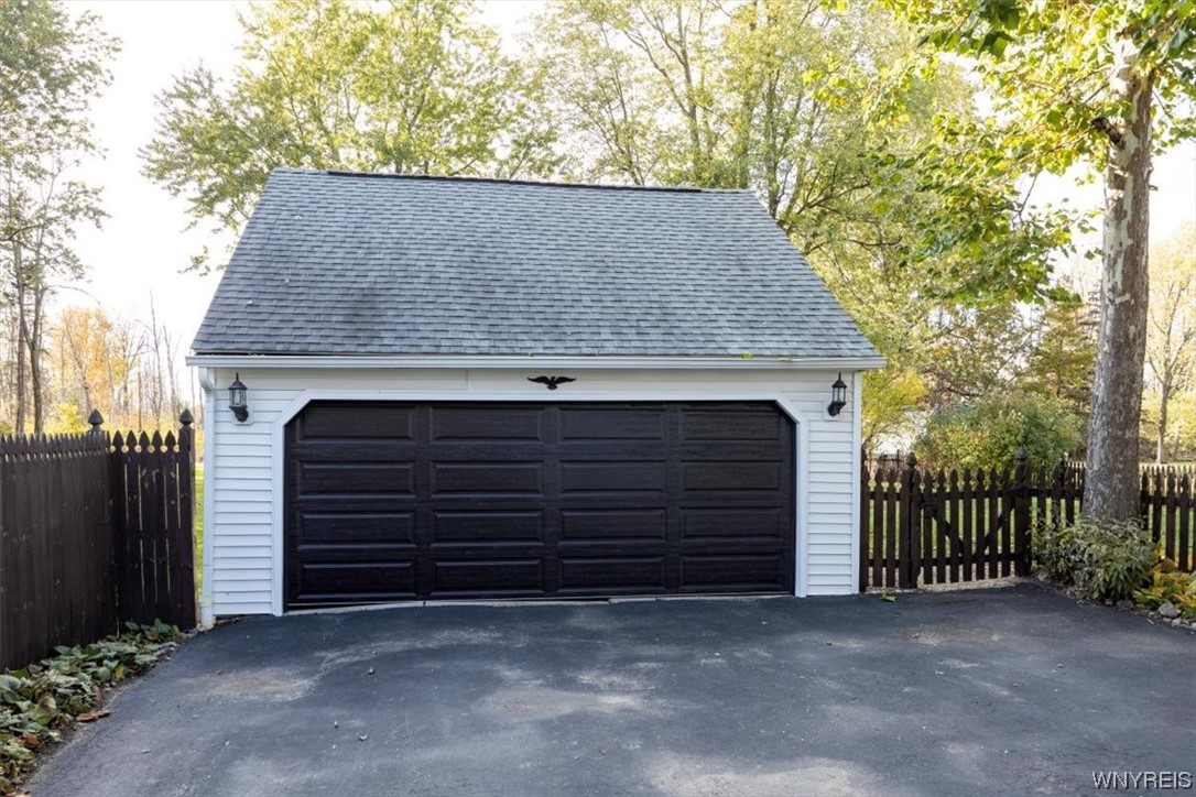 234 Ayer Road Amherst, NY 14221 - Photo 22 of 25 New garage door with voice command for packages.