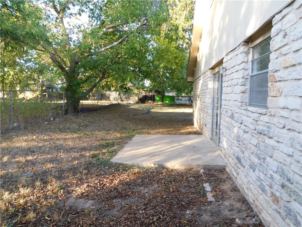 1402 Barbergale Street, Unit A Pflugerville, TX 78660 - Photo 12 of 15 a view of a yard with plants and trees