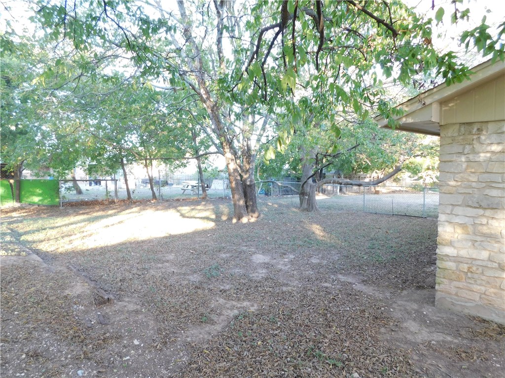 1402 Barbergale Street, Unit A Pflugerville, TX 78660 - Photo 13 of 15 a view of backyard and tree