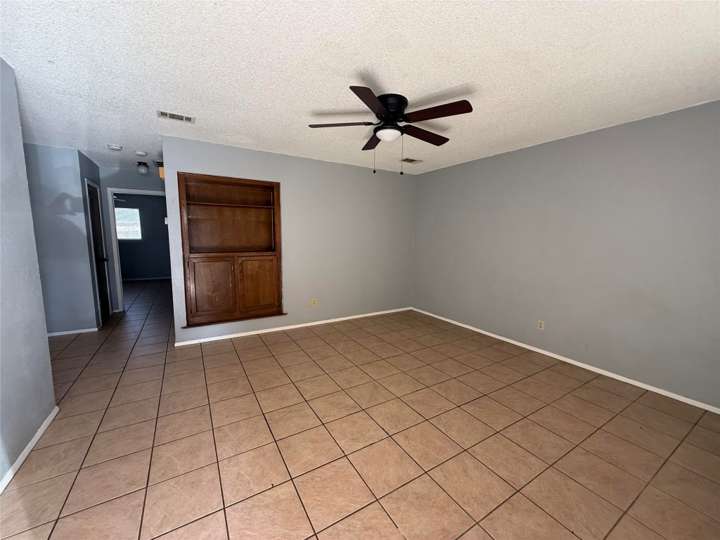 1402 Barbergale Street, Unit A Pflugerville, TX 78660 - Photo 3 of 15 a view of a livingroom with a ceiling fan and window