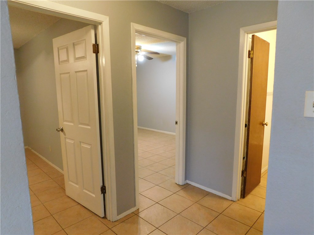 1402 Barbergale Street, Unit A Pflugerville, TX 78660 - Photo 6 of 15 a view of a hallway with wooden floor