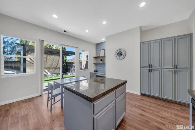 a view of a dining room with furniture wooden floor and chandelier