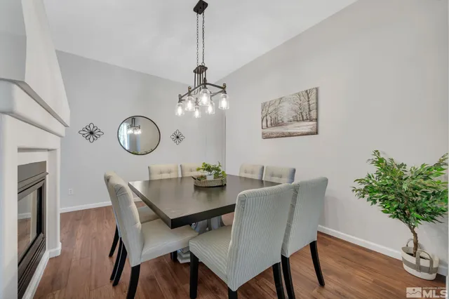 a spacious bedroom with a bed and a chandelier