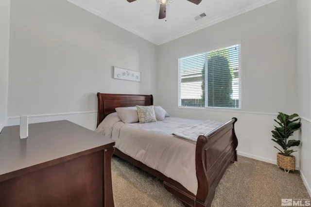 a bedroom with a bed and a view of bedroom