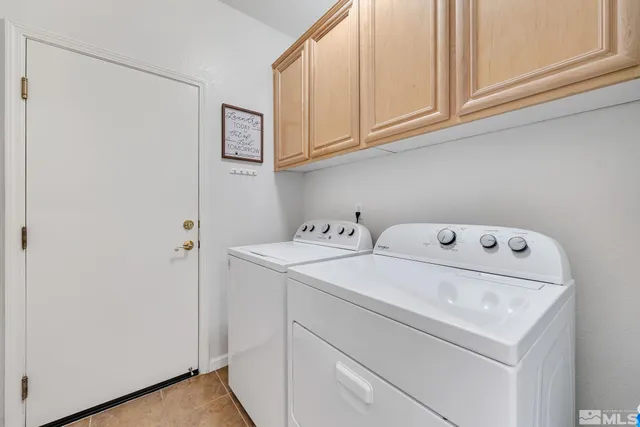 a view of an empty room with windows