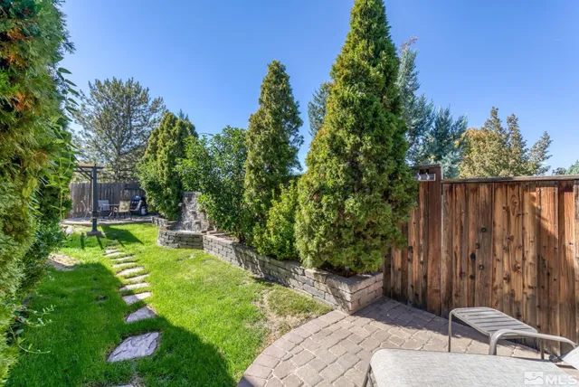a view of patio with a table and chairs