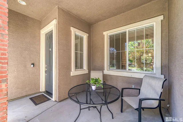 a spacious bedroom with a bed and a chandelier
