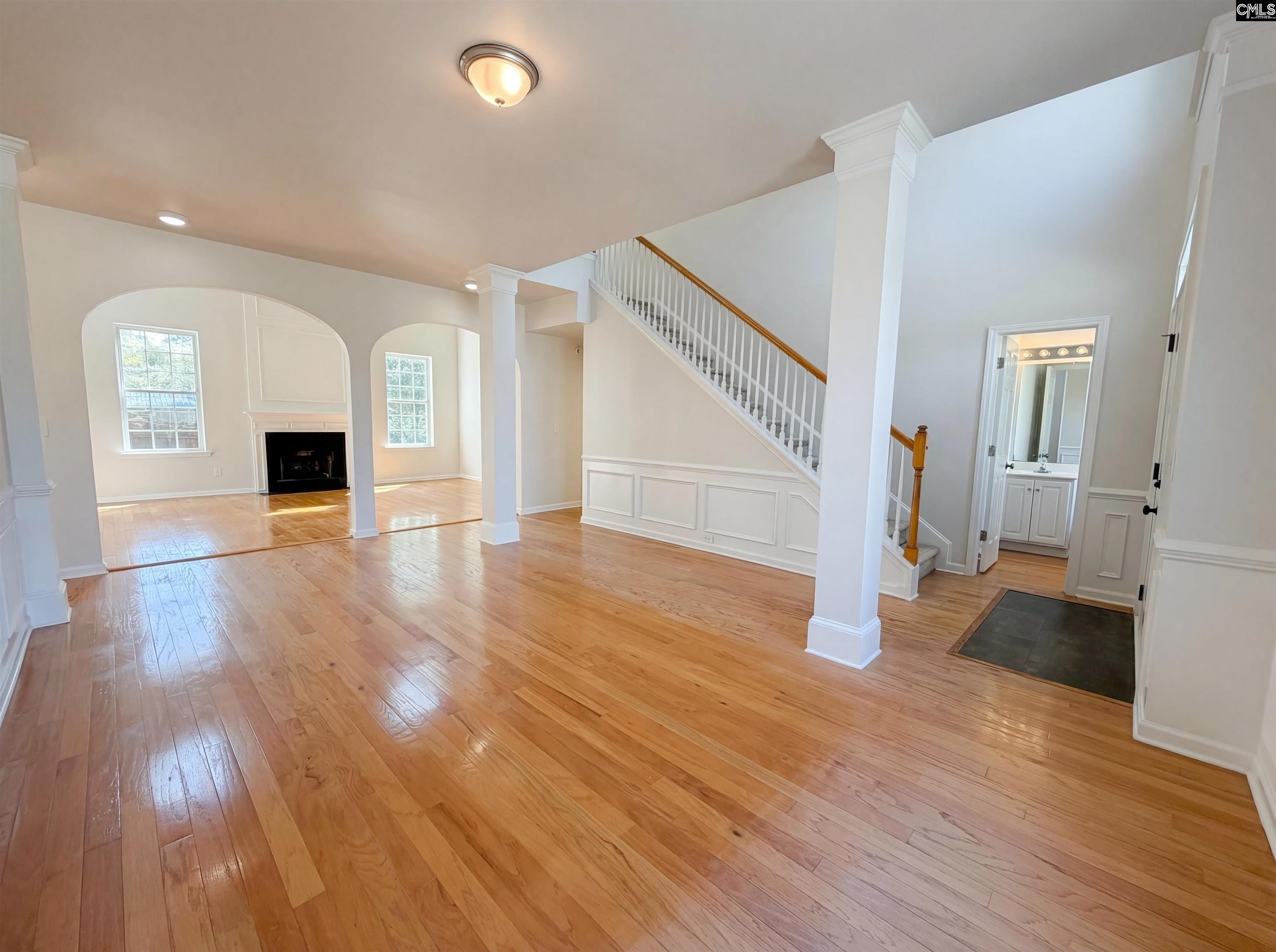 112 Coopers Hawk Circle Irmo, SC 29063 - Photo 15 of 26 a view of a living room with wooden floor and a fireplace