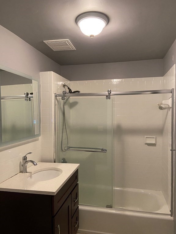 466 Commonwealth Avenue, Unit 503 Boston, MA 02215 - Photo 14 of 17 a bathroom with a sink toilet and shower