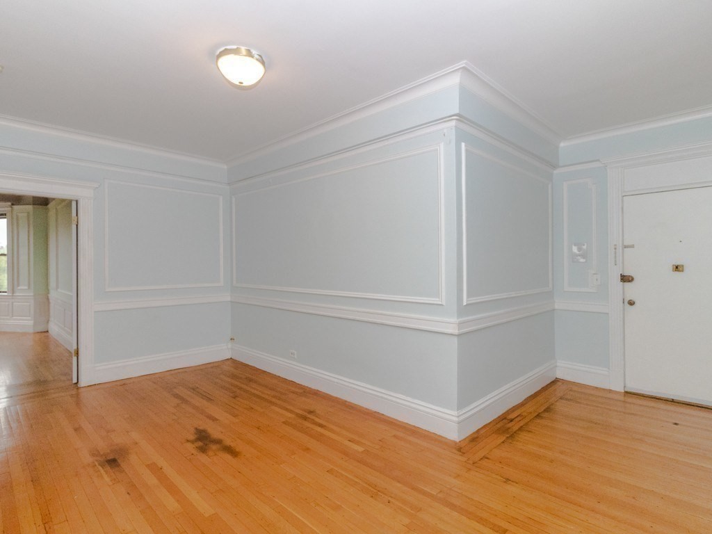 466 Commonwealth Avenue, Unit 503 Boston, MA 02215 - Photo 6 of 17 wooden floor in an empty room