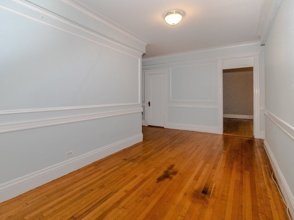 466 Commonwealth Avenue, Unit 503 Boston, MA 02215 - Photo 7 of 17 a view of wooden floor in an empty room