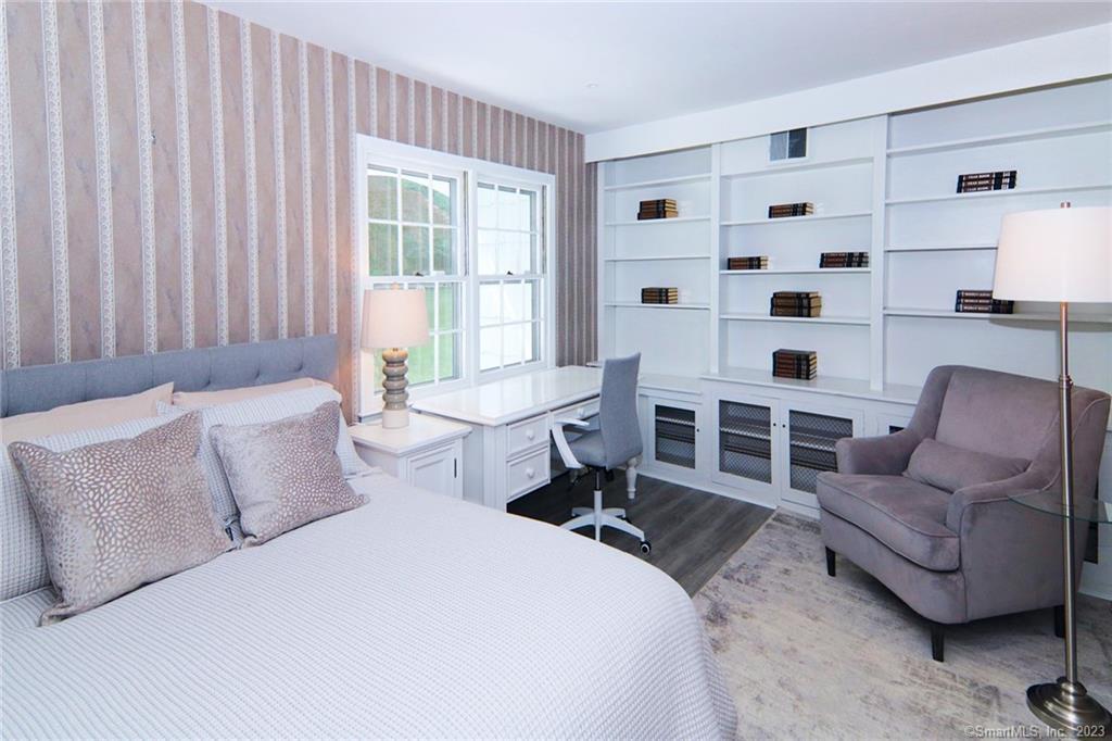 177 Brett Road Fairfield, CT 06824 - Photo 13 of 26 a spacious bedroom with a bed and glass window