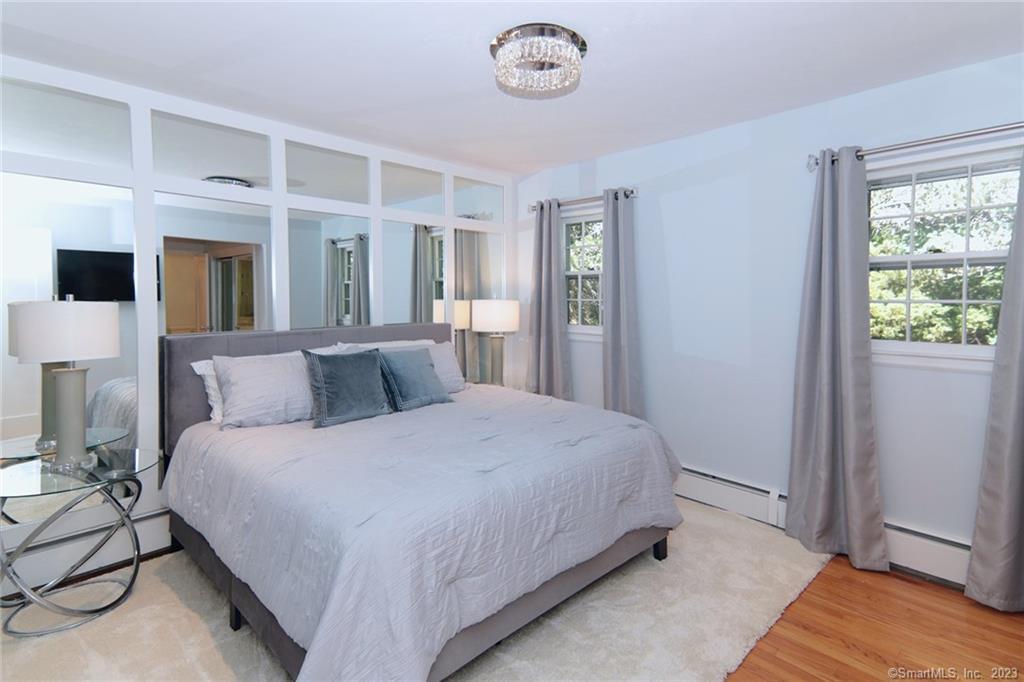 177 Brett Road Fairfield, CT 06824 - Photo 14 of 26 a bedroom with a bed and a window