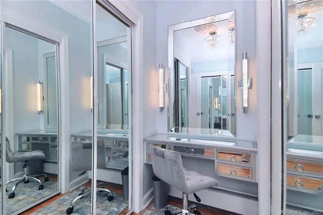 a bathroom with a sink vanity and a mirror