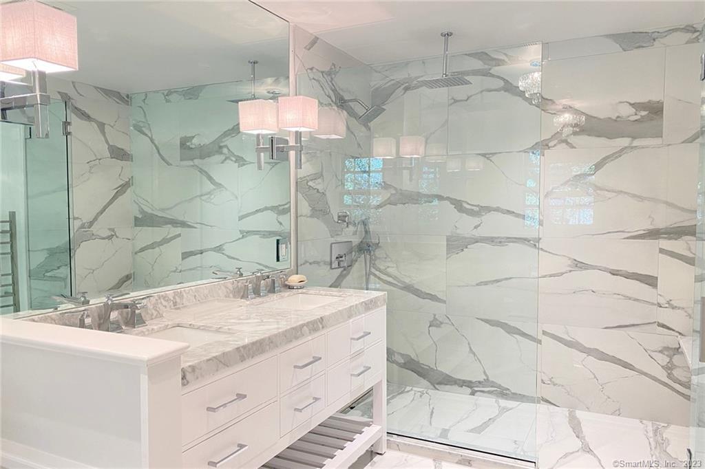 177 Brett Road Fairfield, CT 06824 - Photo 17 of 26 a bathroom with a sink vanity granite and shower