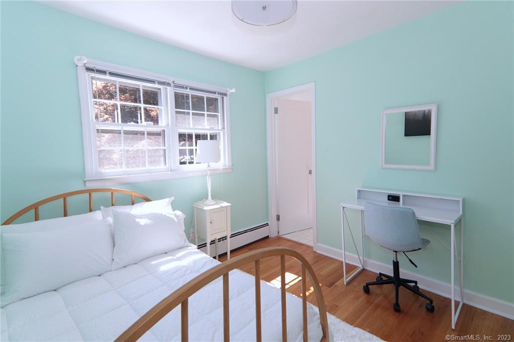 177 Brett Road Fairfield, CT 06824 - Photo 20 of 26 a living room with furniture and a window