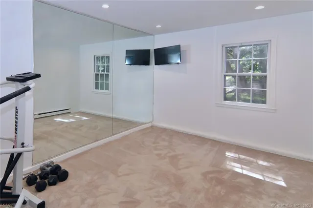 a view of a livingroom with furniture and windows