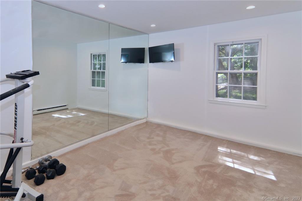 177 Brett Road Fairfield, CT 06824 - Photo 24 of 26 a view of a livingroom with furniture and windows