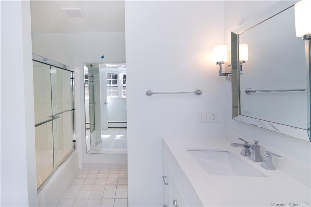 177 Brett Road Fairfield, CT 06824 - Photo 26 of 26 a bathroom with a sink and a mirror