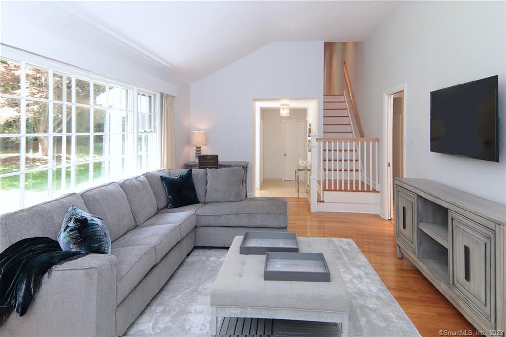 177 Brett Road Fairfield, CT 06824 - Photo 7 of 26 a living room with furniture and a flat screen tv