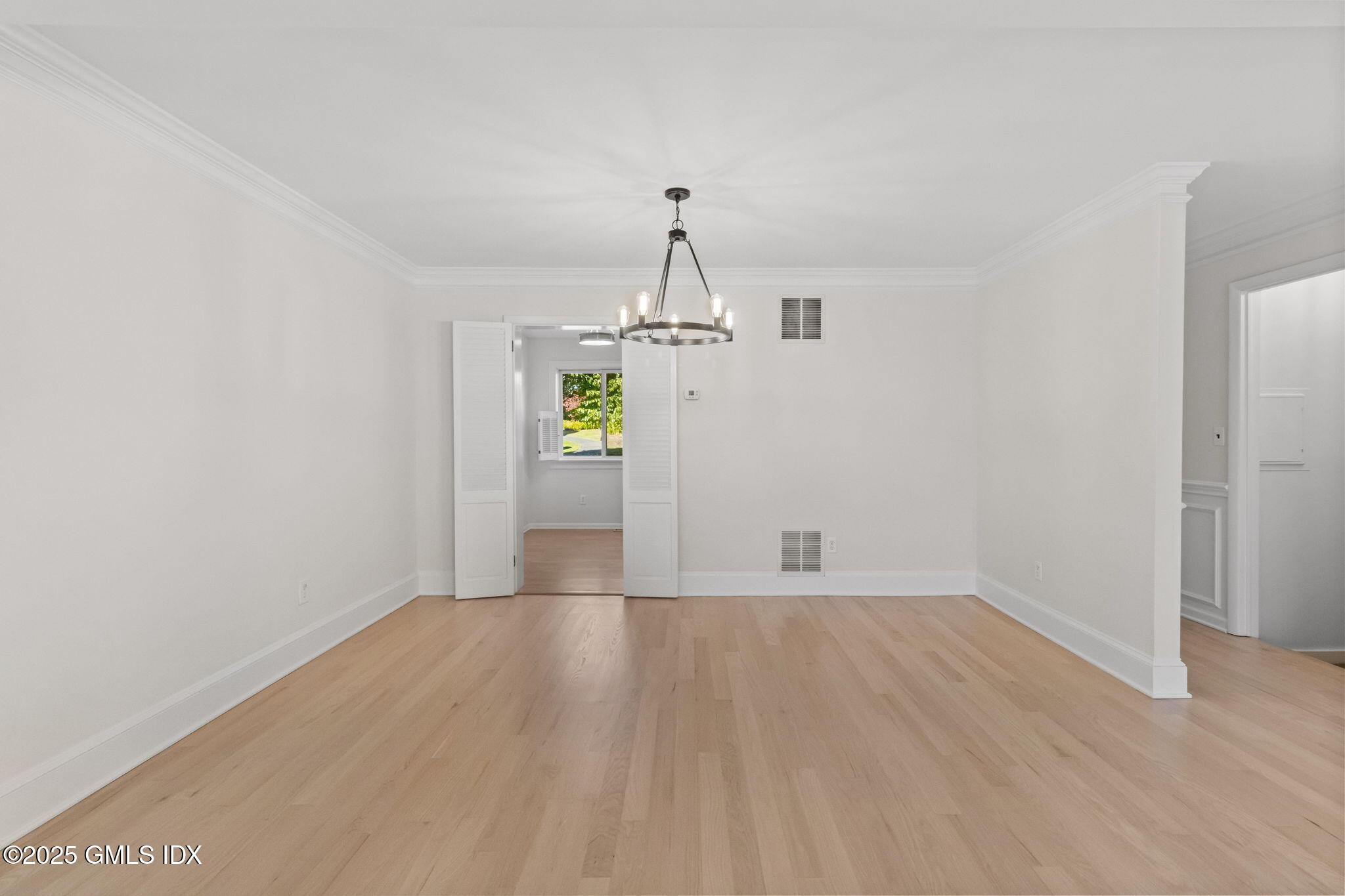 83 Silo Circle Riverside, CT 06878 - Photo 15 of 30 wooden floor in an empty room with a window