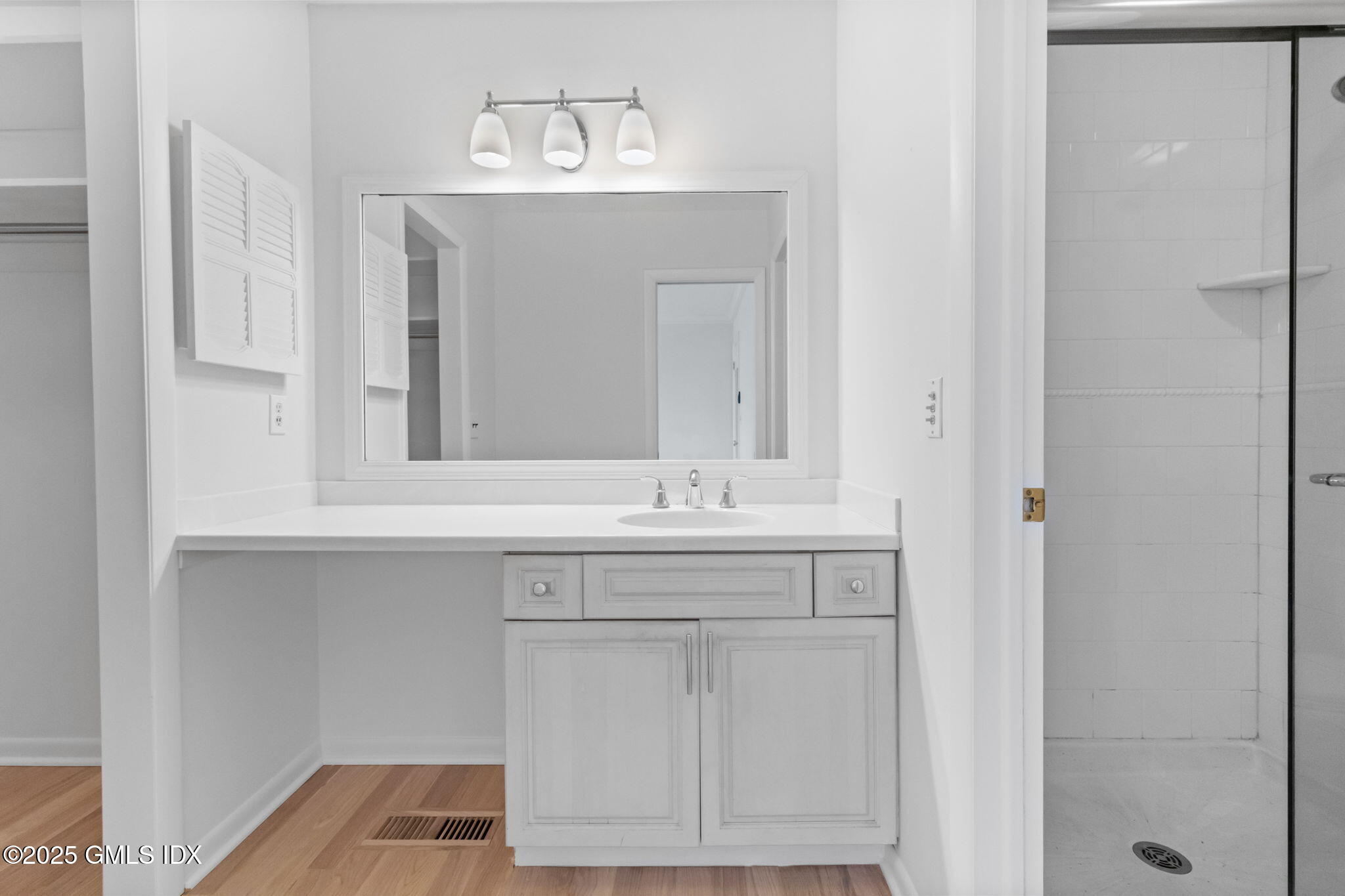 83 Silo Circle Riverside, CT 06878 - Photo 20 of 30 a bathroom with a sink and a mirror