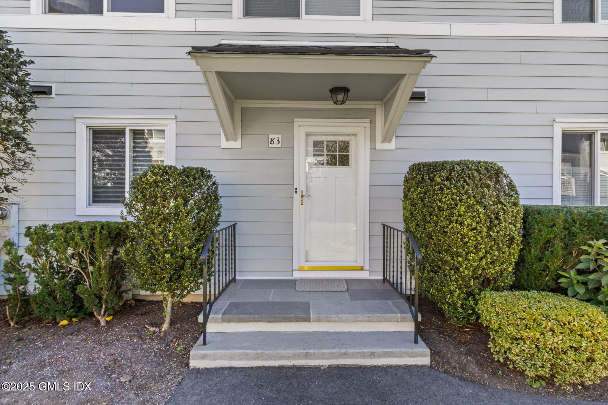 83 Silo Circle Riverside, CT 06878 - Photo 2 of 30 a front view of a house with garden