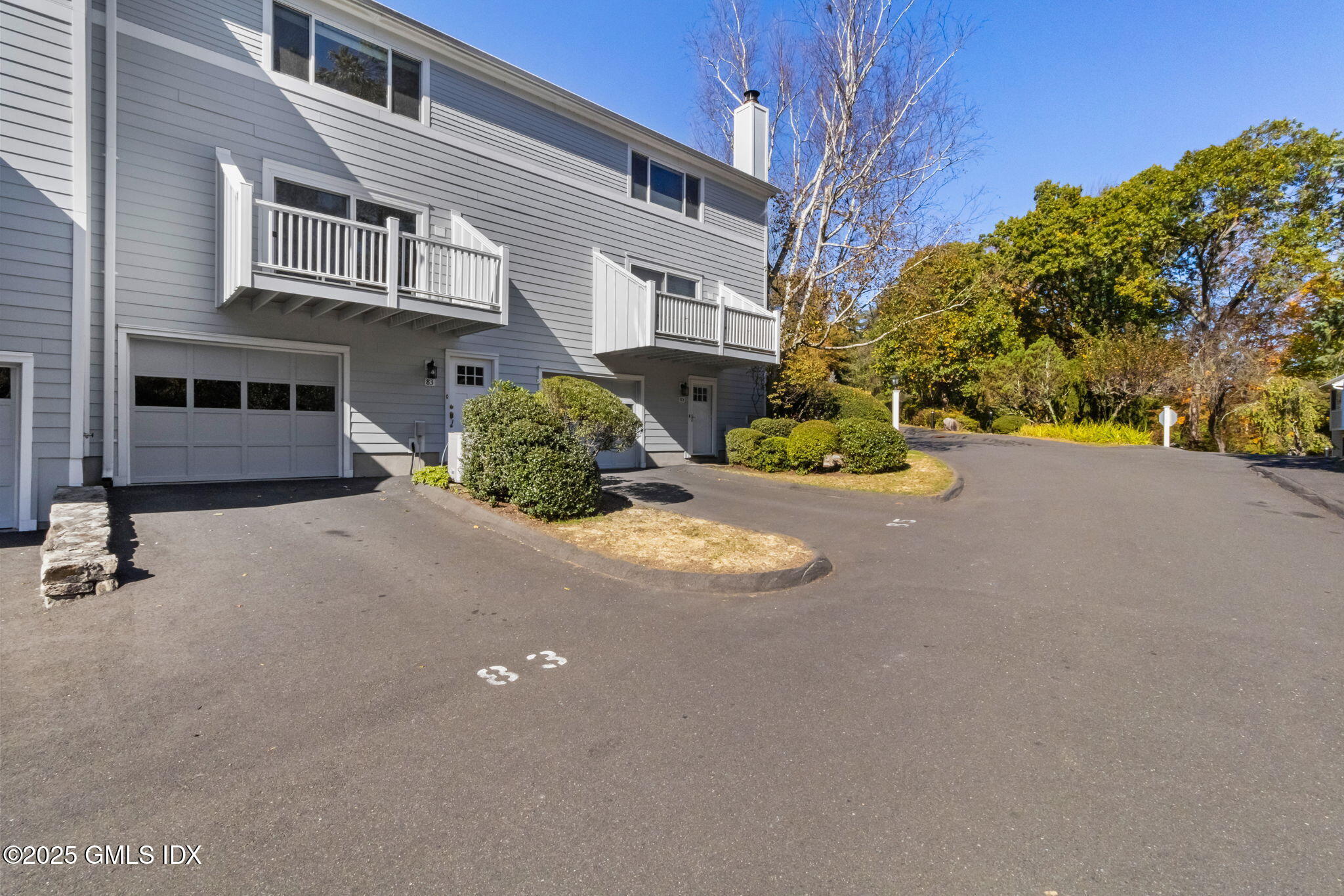 83 Silo Circle Riverside, CT 06878 - Photo 4 of 30 a front view of a house with a yard and garage