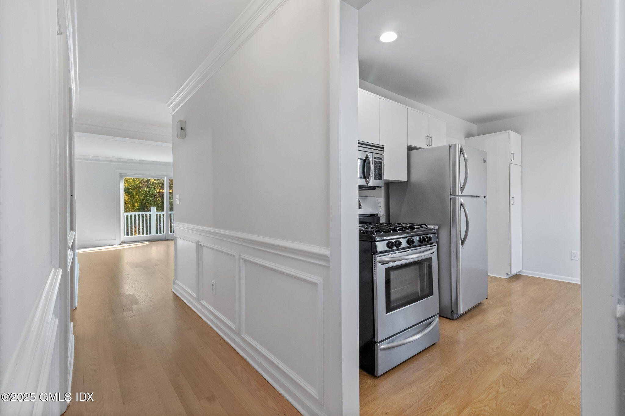 83 Silo Circle Riverside, CT 06878 - Photo 6 of 30 a kitchen with stainless steel appliances a refrigerator stove and microwave