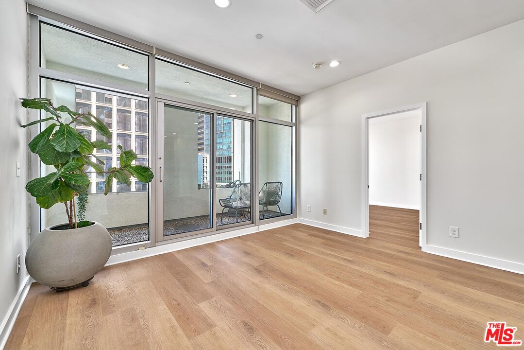 3810 Wilshire Boulevard, Unit 404 Los Angeles, CA 90010 - Photo 11 of 43 a view of an entryway with wooden floor