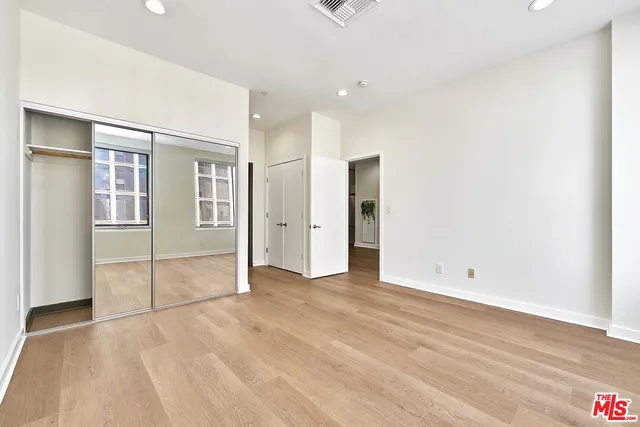 a view of kitchen with refrigerator and plant